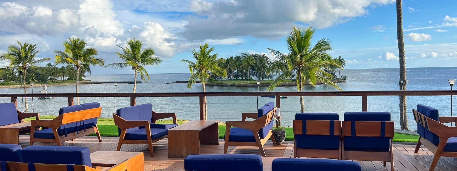 Outdoor seating with ocean view at Sunset Bar in The Naviti Resort, Korolevu
