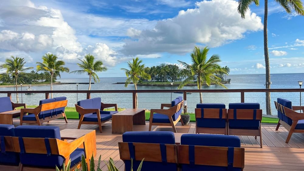 Outdoor seating with ocean view at Sunset Bar in The Naviti Resort, Korolevu.