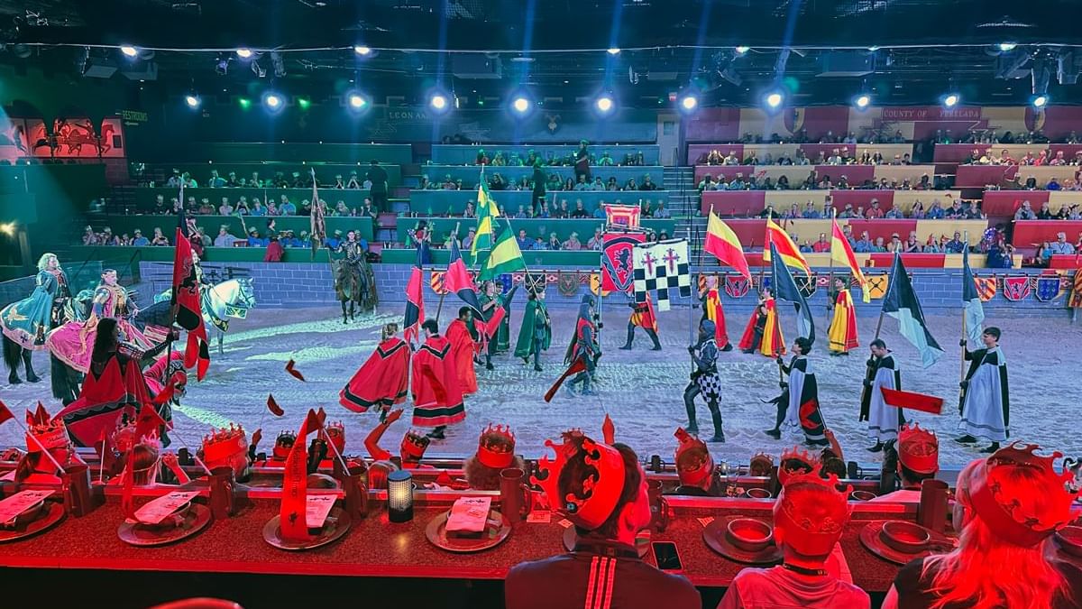 A medieval-themed dining experience with a performance in a large arena