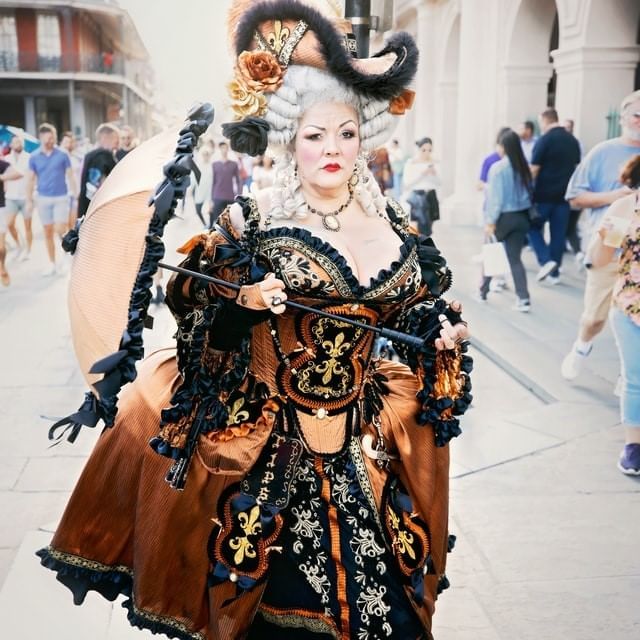 A woman dressed in a Halloween costume near La Galerie Hotel