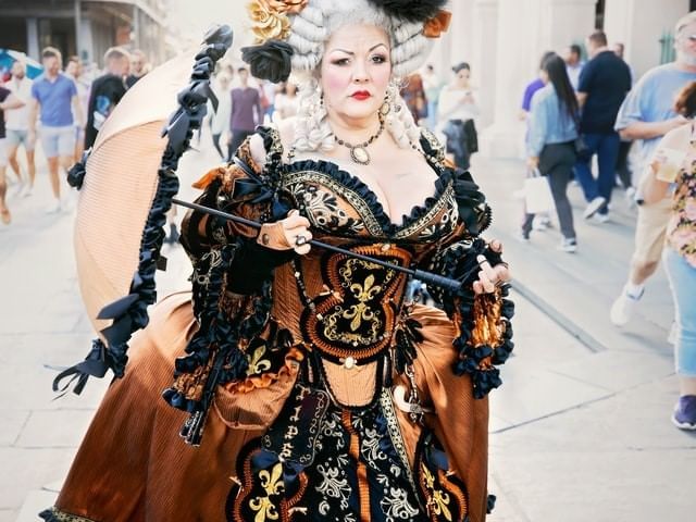 A woman dressed in a Halloween costume near La Galerie Hotel