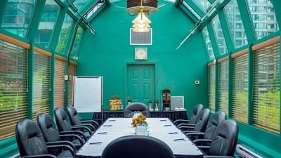 Yaletown Rooms featuring a glass roof and teal accent wall at Rosedale on Robson Suite Hotel, meeting rooms in Vancouver, BC