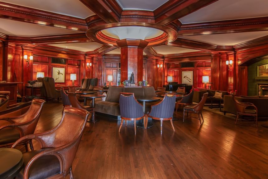 Seating area with wooden floors in The Fireside Room at Hotel Sorrento