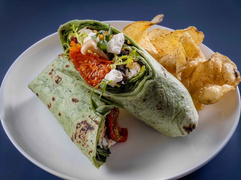 Close-up of a lunch wrap with crackers at The Press in The Diplomat Resort