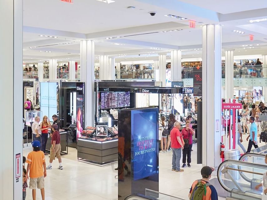 People bustling around The Florida Mall near Lake Buena Vista Resort Village & Spa