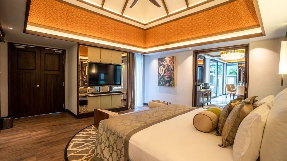 Spacious Royal Villa bedroom with illuminated ceiling, king bed, and modern amenities at The Banjaran Hotsprings Retreat.