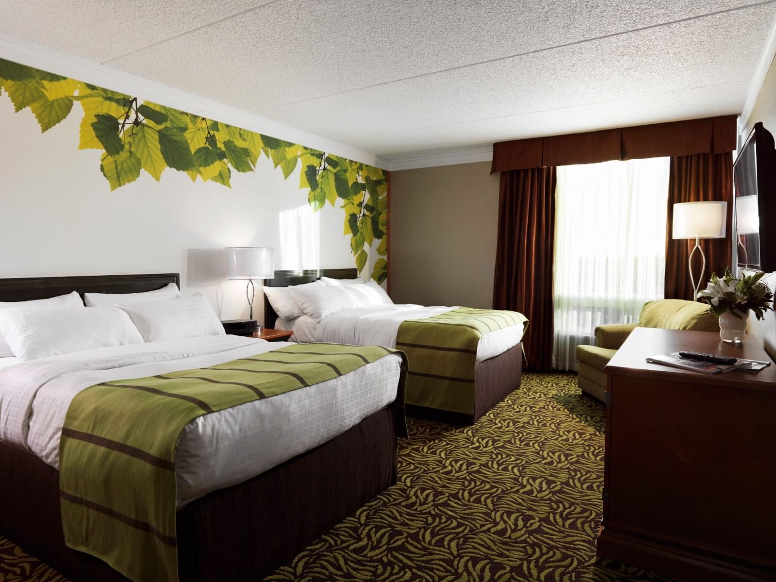 Two king-size beds & a sofa in Deluxe Two Doubles at Varscona Hotel on Whyte