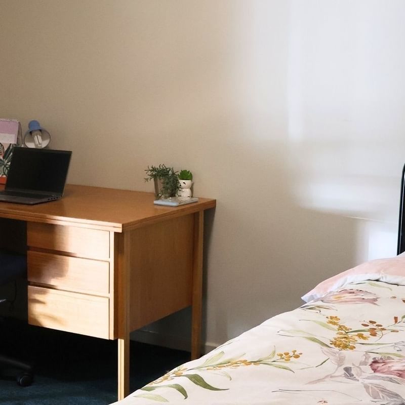 Bedroom with desk and bed at La Trobe University - Villas.