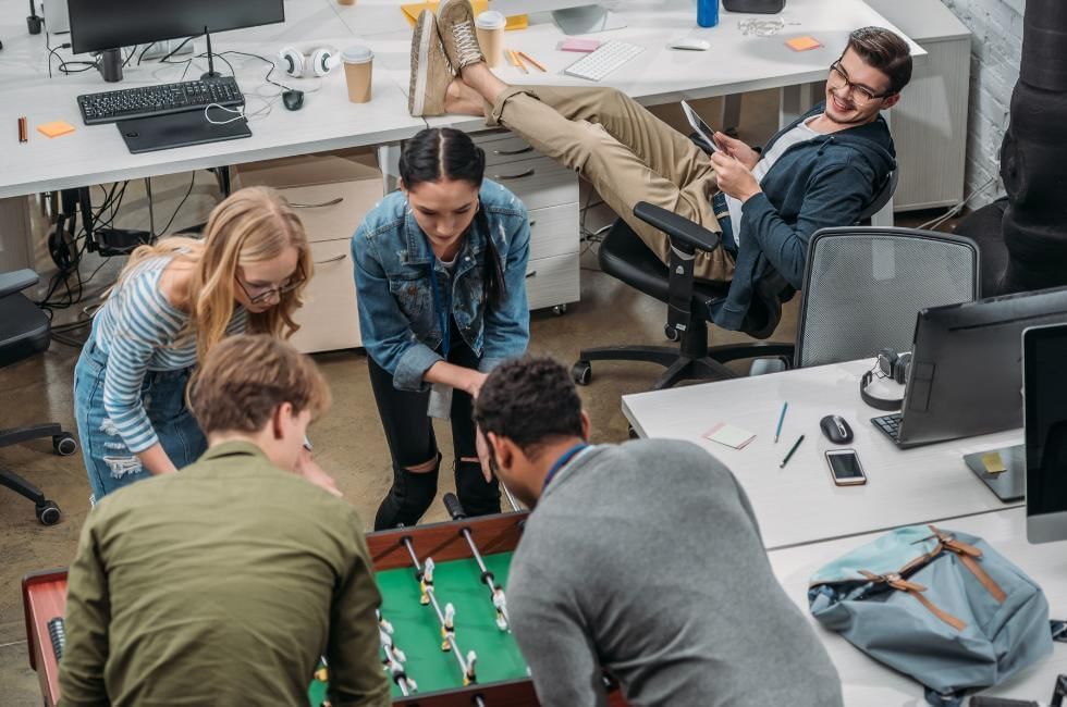 Wellbeing activities for team meetings featuring table soccer