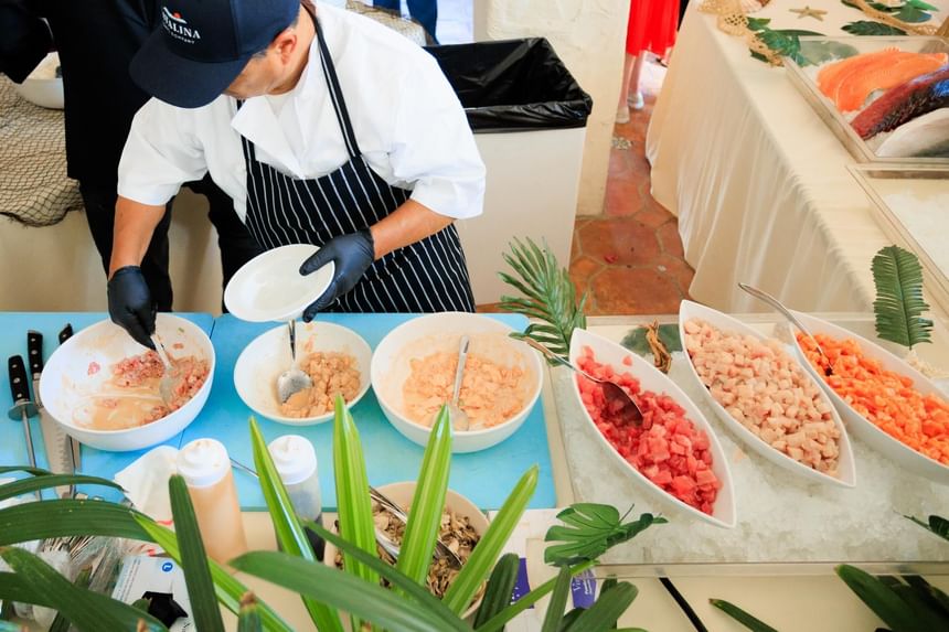 Chef preparing seafood dishes at the Catalina Wine Mixer near Catalina Island luxury hotels