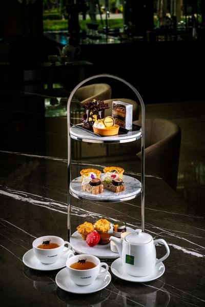 High tea platter served with snacks at Carlton Hotel Bangkok Sukhumvit