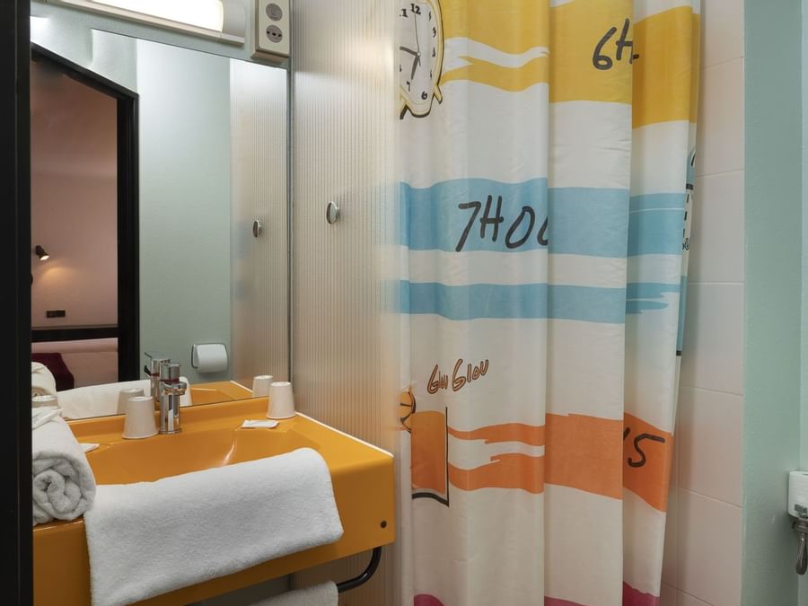 Bathroom vanity in bedrooms at Hotel Bourges North