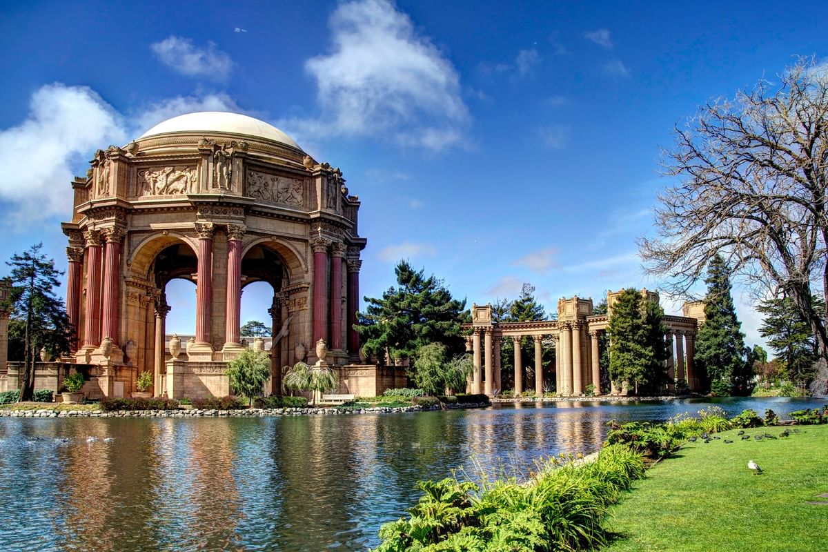 Palace of Fine Arts by a calm lagoon under a blue sky near Warwick San Francisco