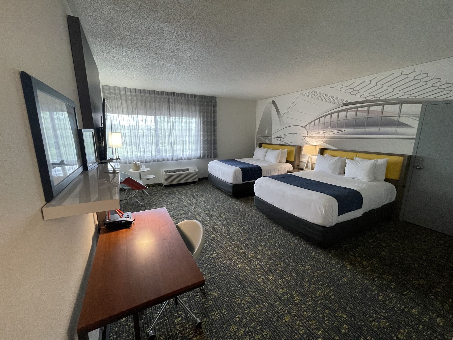 Two beds, sitting area & workspace in Double Queen Oversize at St. Louis Airport Hotel