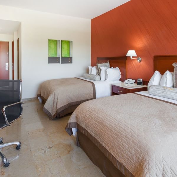Twin comfy beds in Superior Room at Gamma Hotels