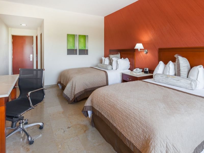 Twin comfy beds in Superior Room at Gamma Hotels