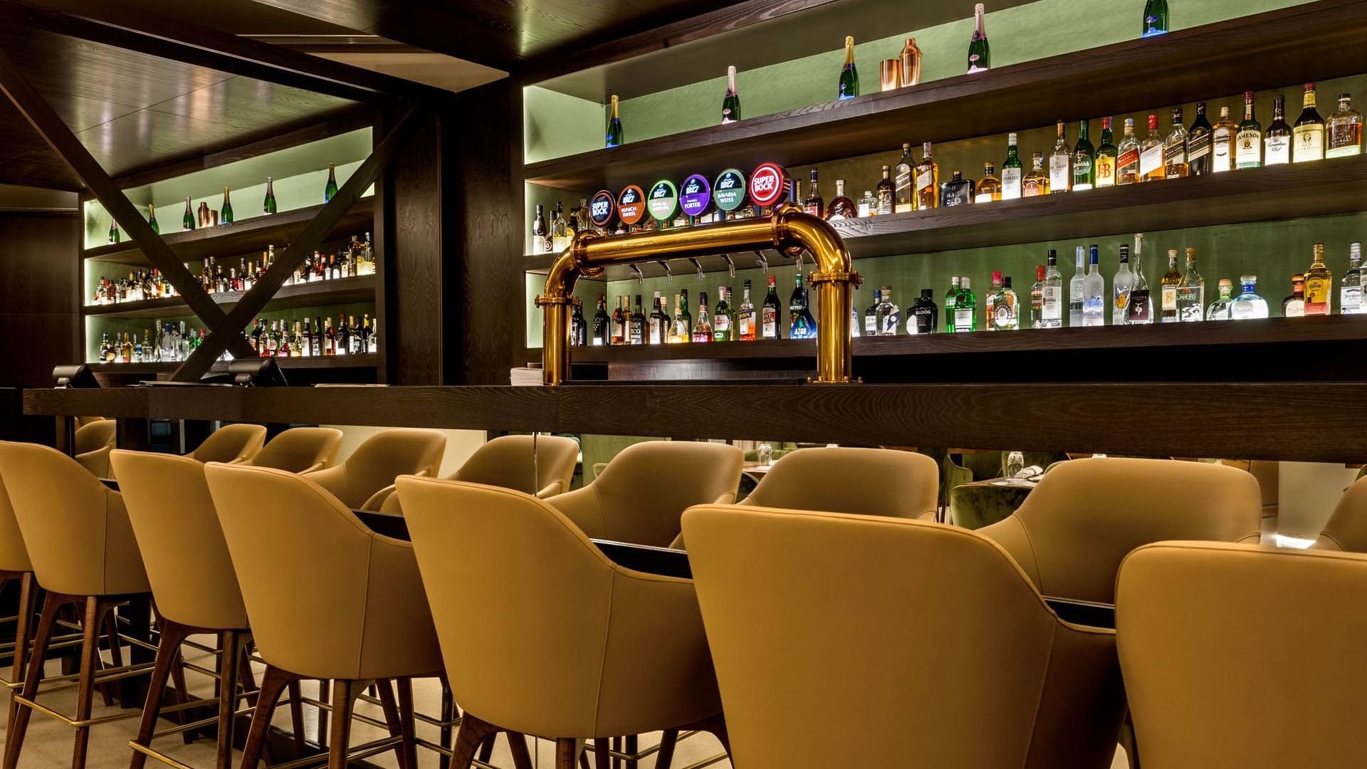 High chairs by the bar counter in Vapore bar at Grand Hotel Açores Atlântico