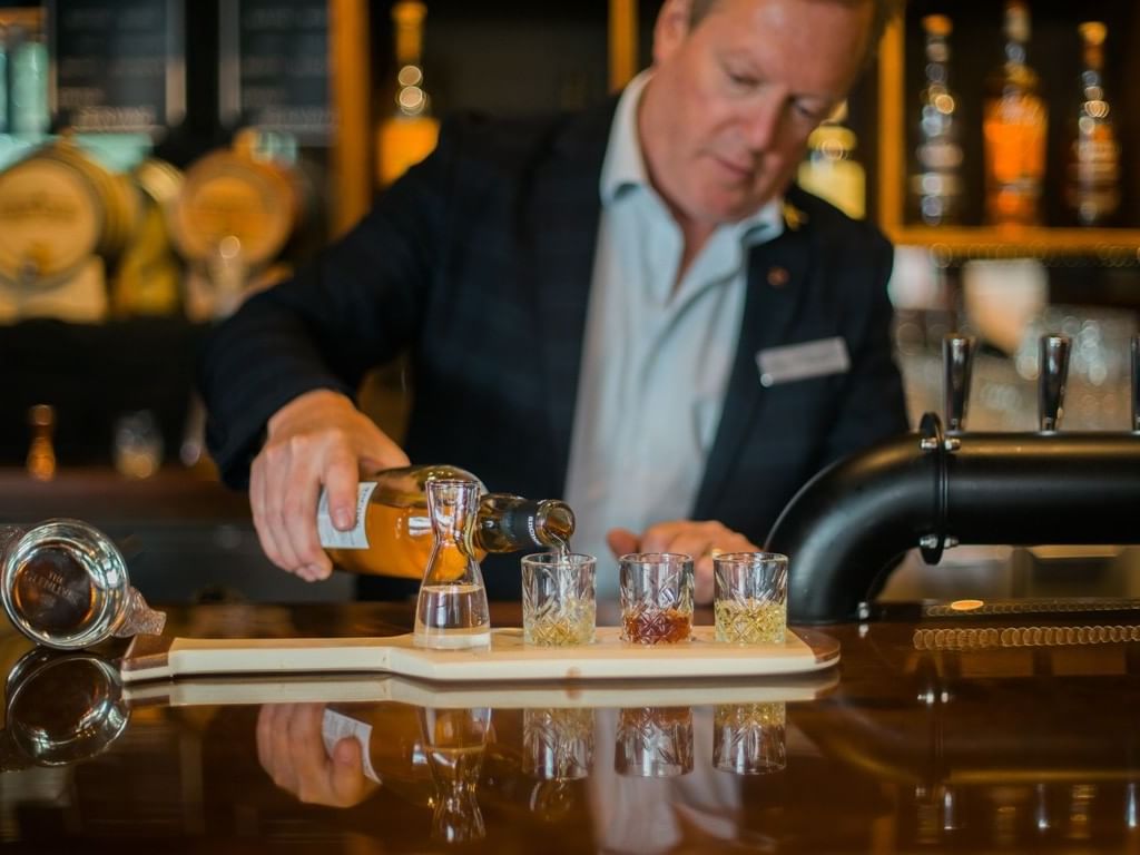 A Bartender in Whiskey Room at Manteo Resort Waterfront