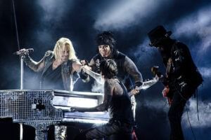 Mötley Crüe performing on stage at Rosen Inn Universal