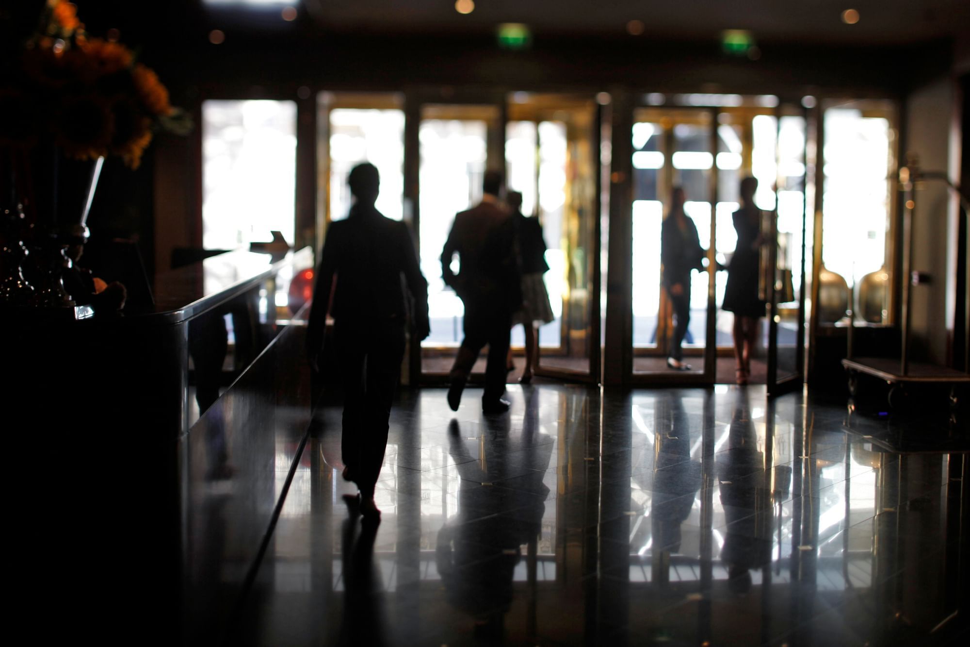People walking in the lobby lounge area at Warwick Paris Champs Elysées