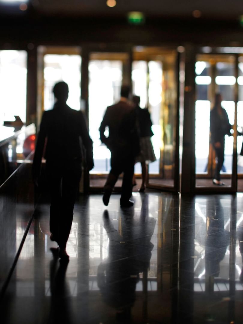 People walking in the lobby lounge area at Warwick Paris Champs Elysées