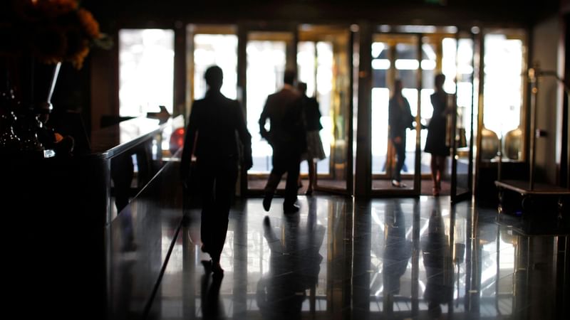 People walking in the lobby lounge area at Warwick Paris Champs Elysées