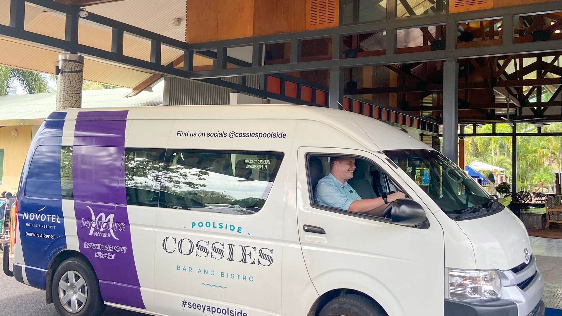 Shuttle parked at the entrance of Novotel Darwin Airport