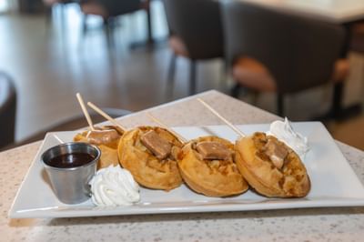 Belgian Waffles with Maple Syrup, Butter and Whipped Cream