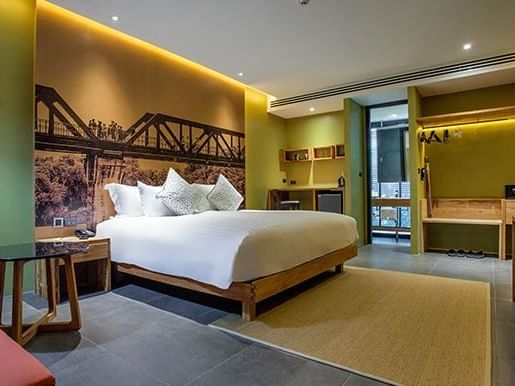 Queen size bed in Deluxe Connecting room at U Hotels and Resort