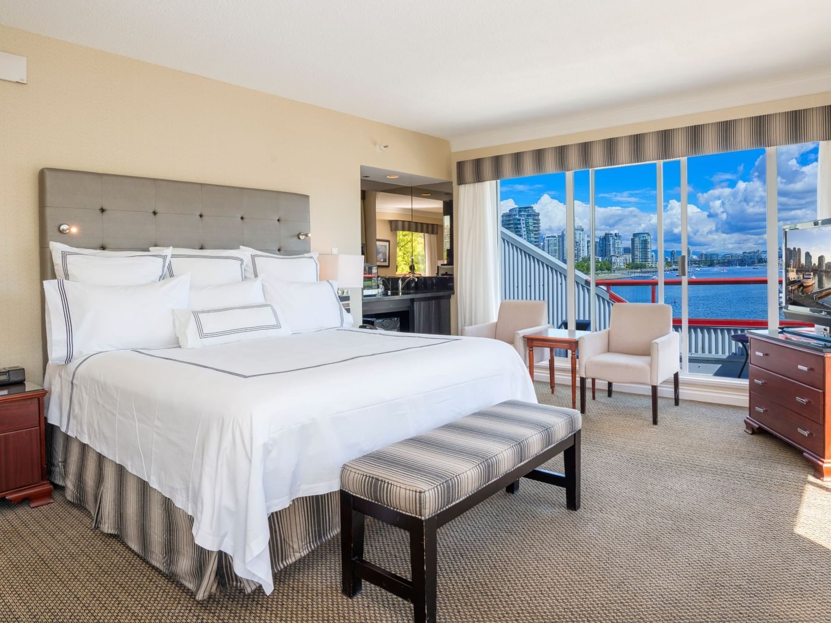 Boardwalk Suite bedroom with king bed at Granville Island Hotel