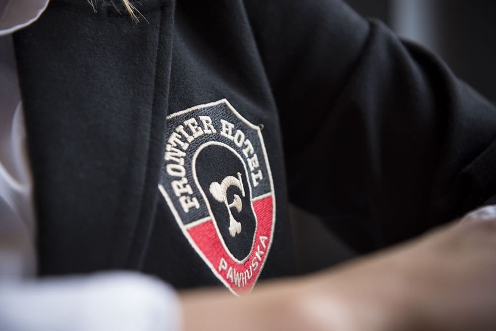 Frontier Hotel logo on t-shirt at The Frontier Hotel Pawhuska