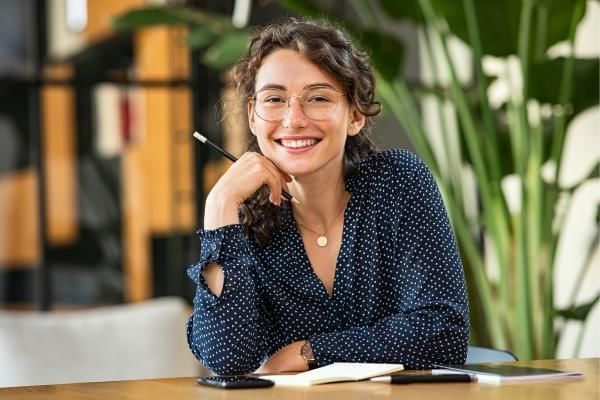 Women looking happy as she is in a hybrid job role