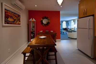 Kitchen area with dining table in Apartment 202 at Retro Suites Hotel