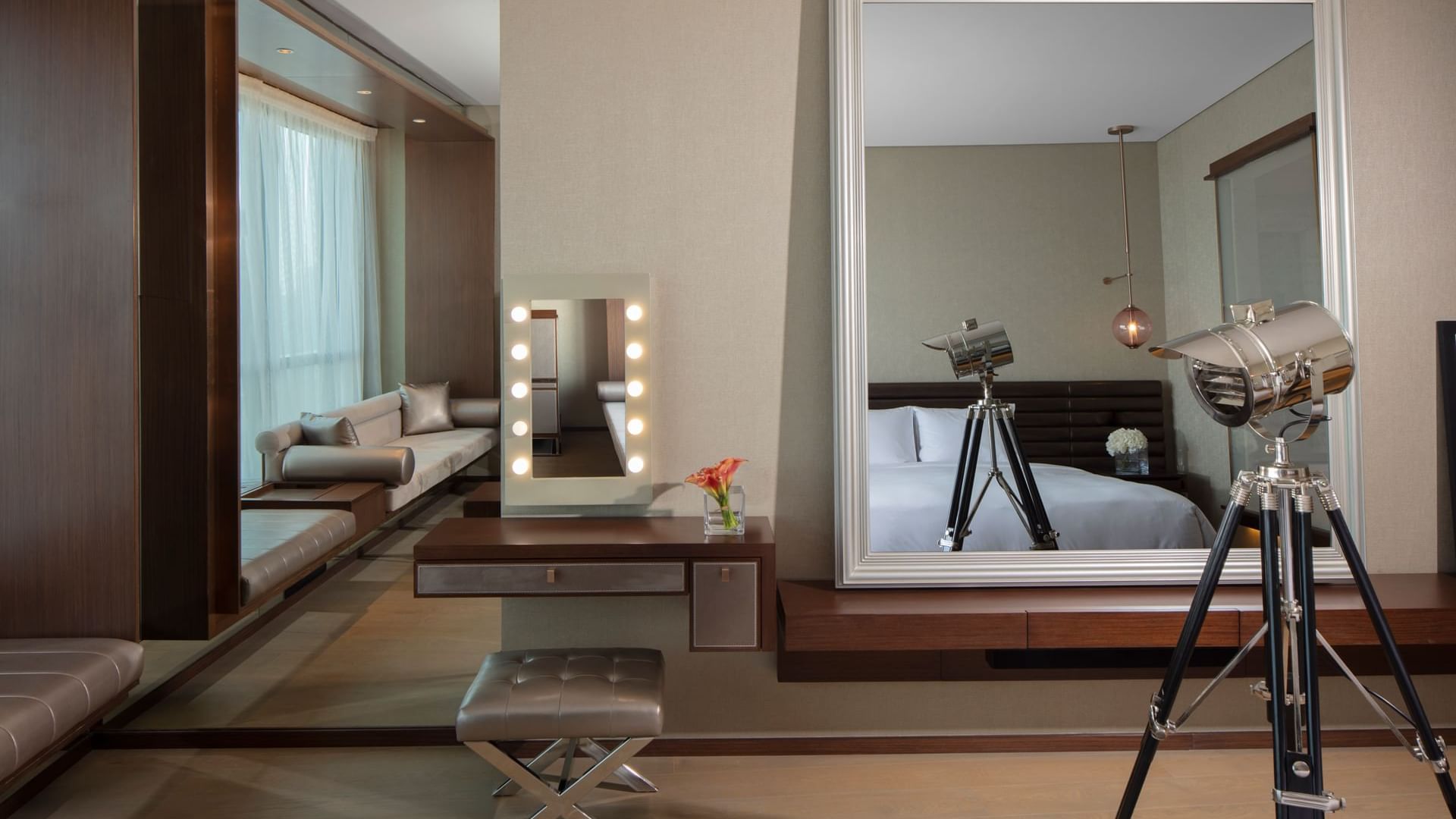 Vanity with doorway to lounge area in the Scene Proscenium Room at Paramount Hotel Dubai