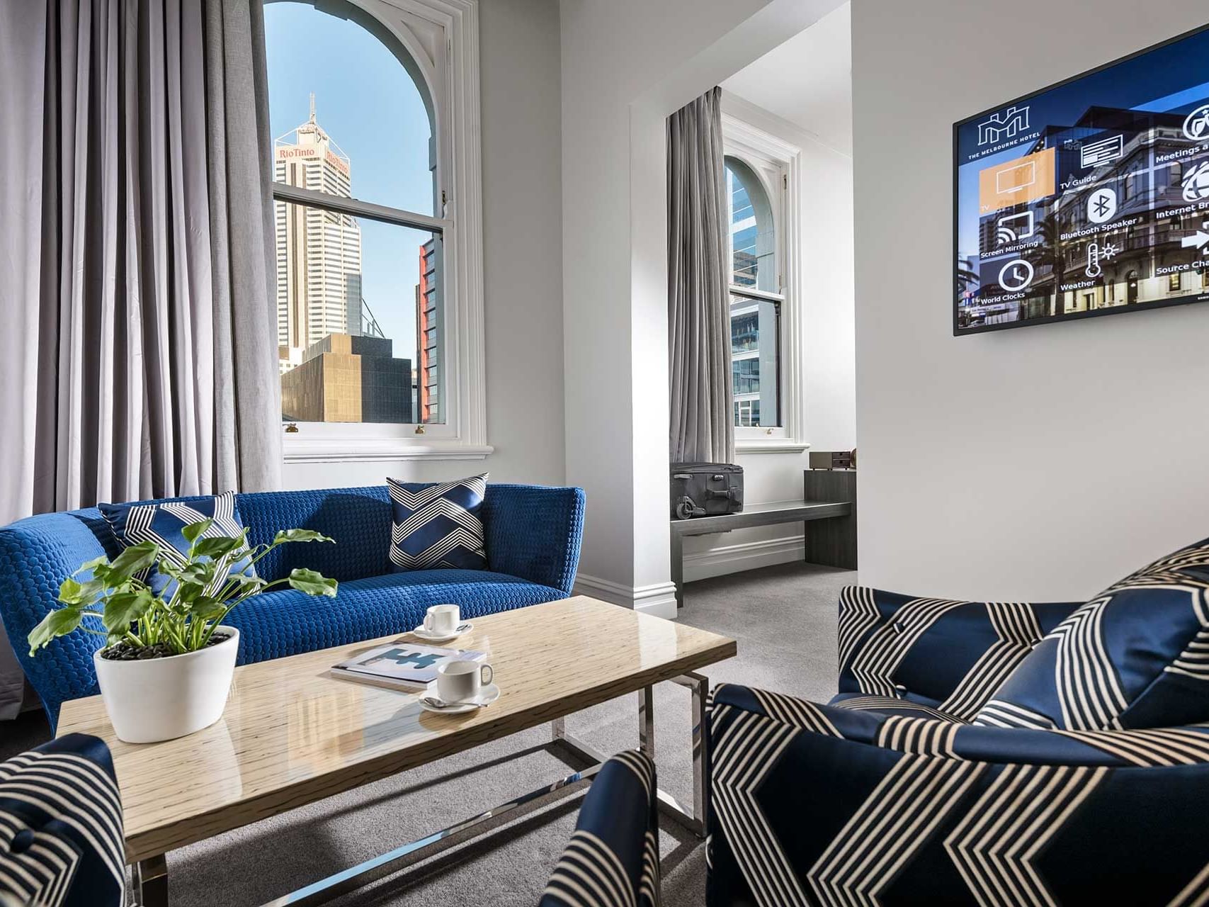 Living area with comfy seating in Heritage Suite at Melbourne Hotel Perth