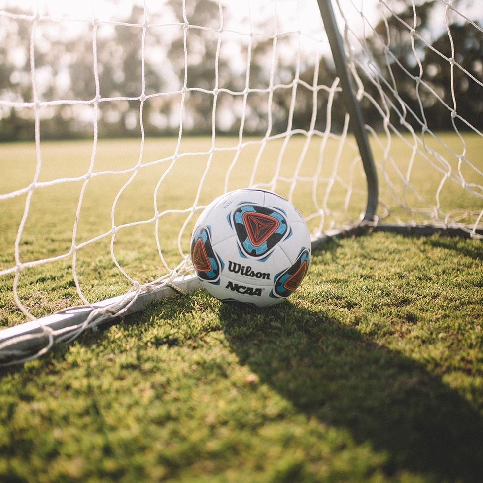 Close-up of a football next to a net near Falkensteiner Resort Capo Boi