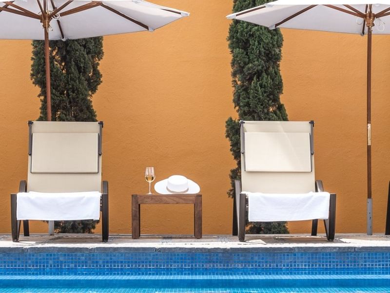 Two sunbeds by the pool at Grand Fiesta Americana Querétaro