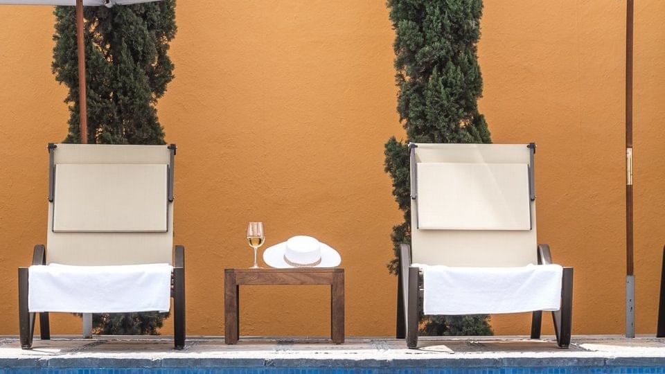 Two sunbeds by the pool at Grand Fiesta Americana Querétaro