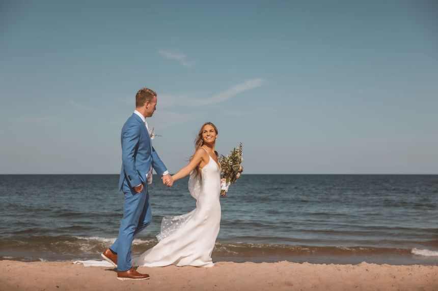 Wedding couple on the beach near Ocean Place Resort & Spa