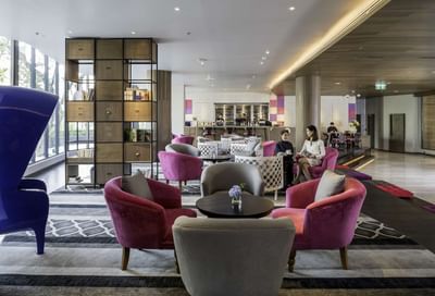 Lounge area with comfortable seating at U Hotels & Resorts