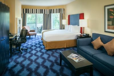 Parlor King Creekview with work and sitting area of Plaza Inn & Suites at Ashland Creek​