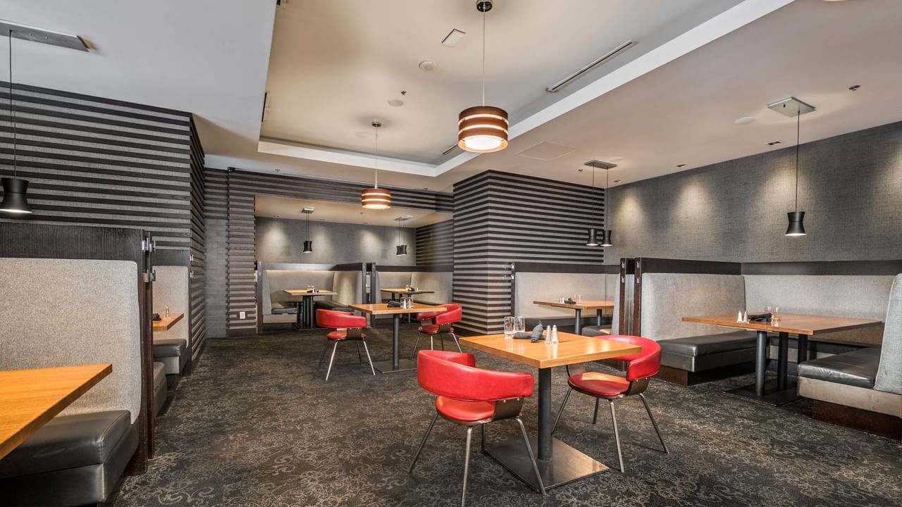 Dining table and red seats at Prestons Restaurant + Lounge