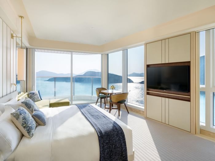 Comfy bed and TV in Smart Balcony Oceanfront Lookout at Fullerton Ocean Park Hotel Hong Kong