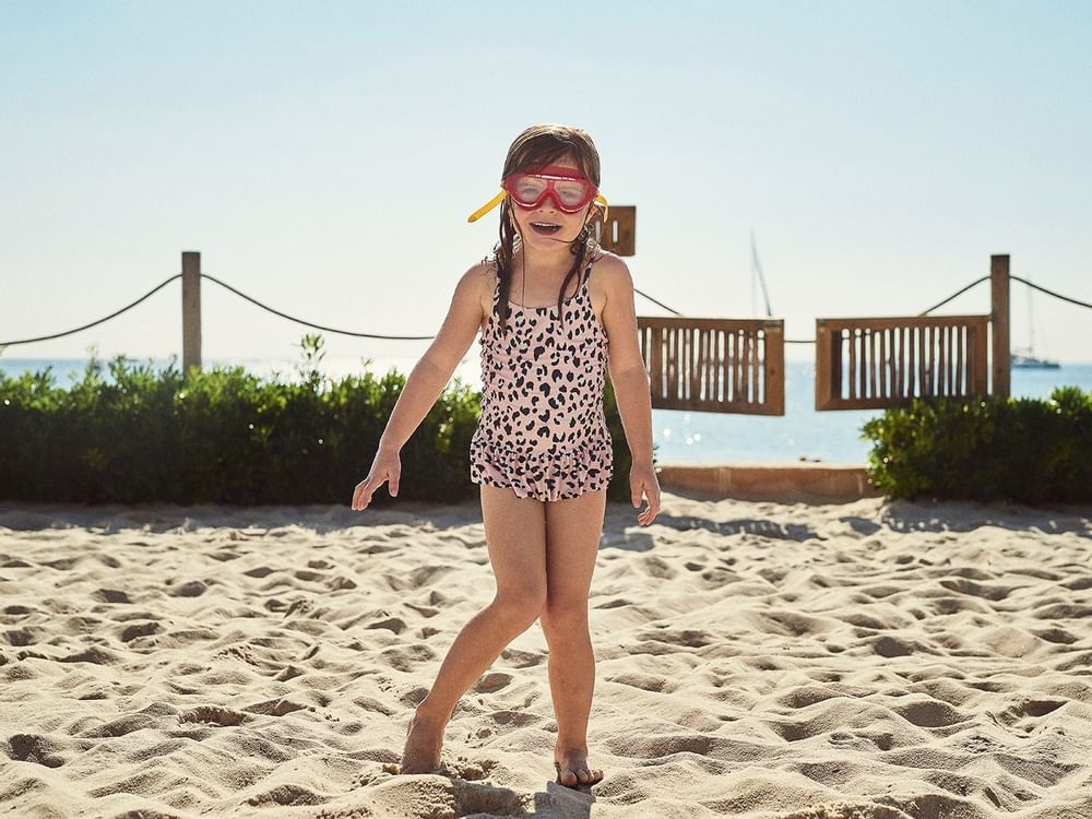 Child on beach in Ibiza
