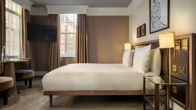 A luxurious Collection Deluxe Room at The May Fair Hotel in London.