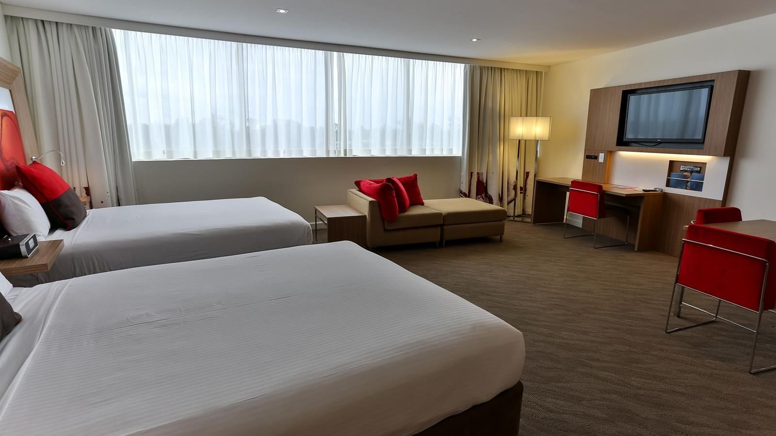 Interior of Deluxe suite with 2 Queen Beds at Novotel Sydney