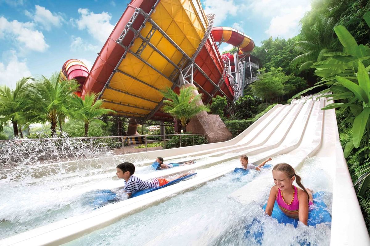 Kids playing with water sliders in the waterpark at Sunway Hotels & Resorts