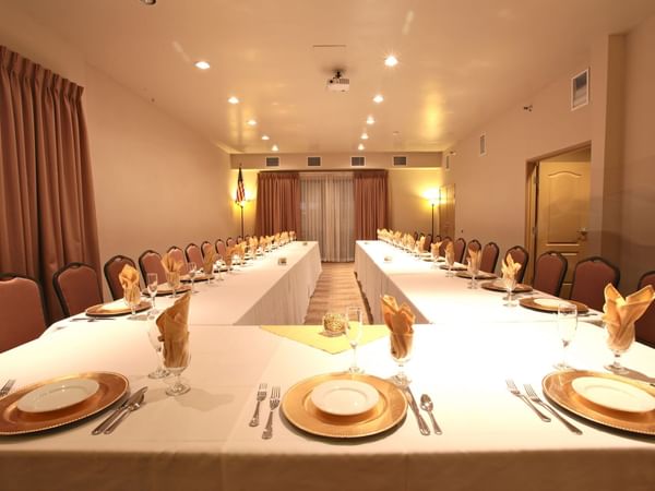 U shaped dining table set up for event