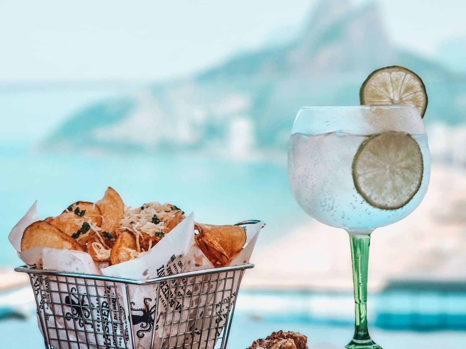 Snacks and a Cocktail glass in a pool bar at Sol Ipanema Hotel