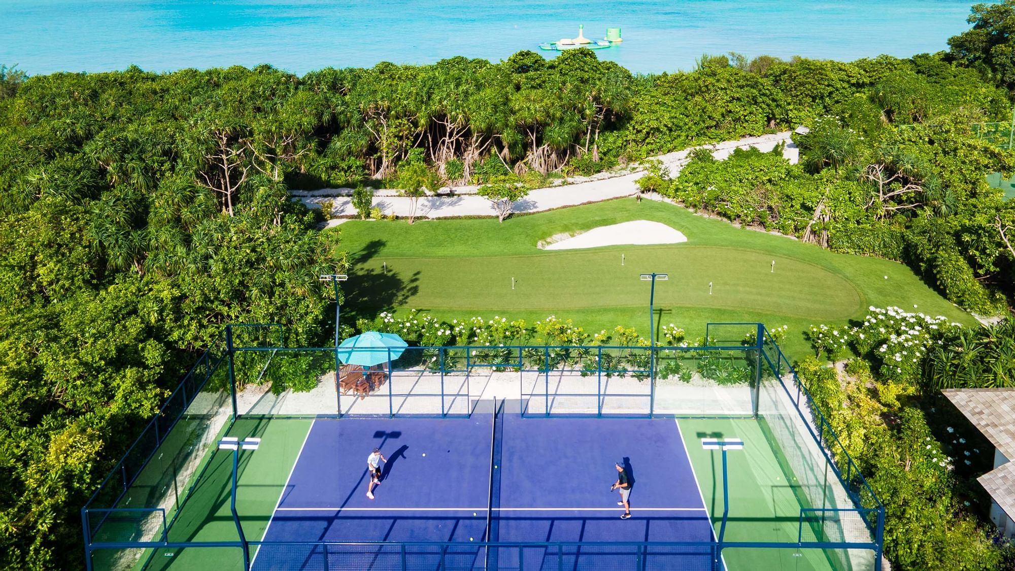 Aerial view of the tennis court & sea, The Signature Collection